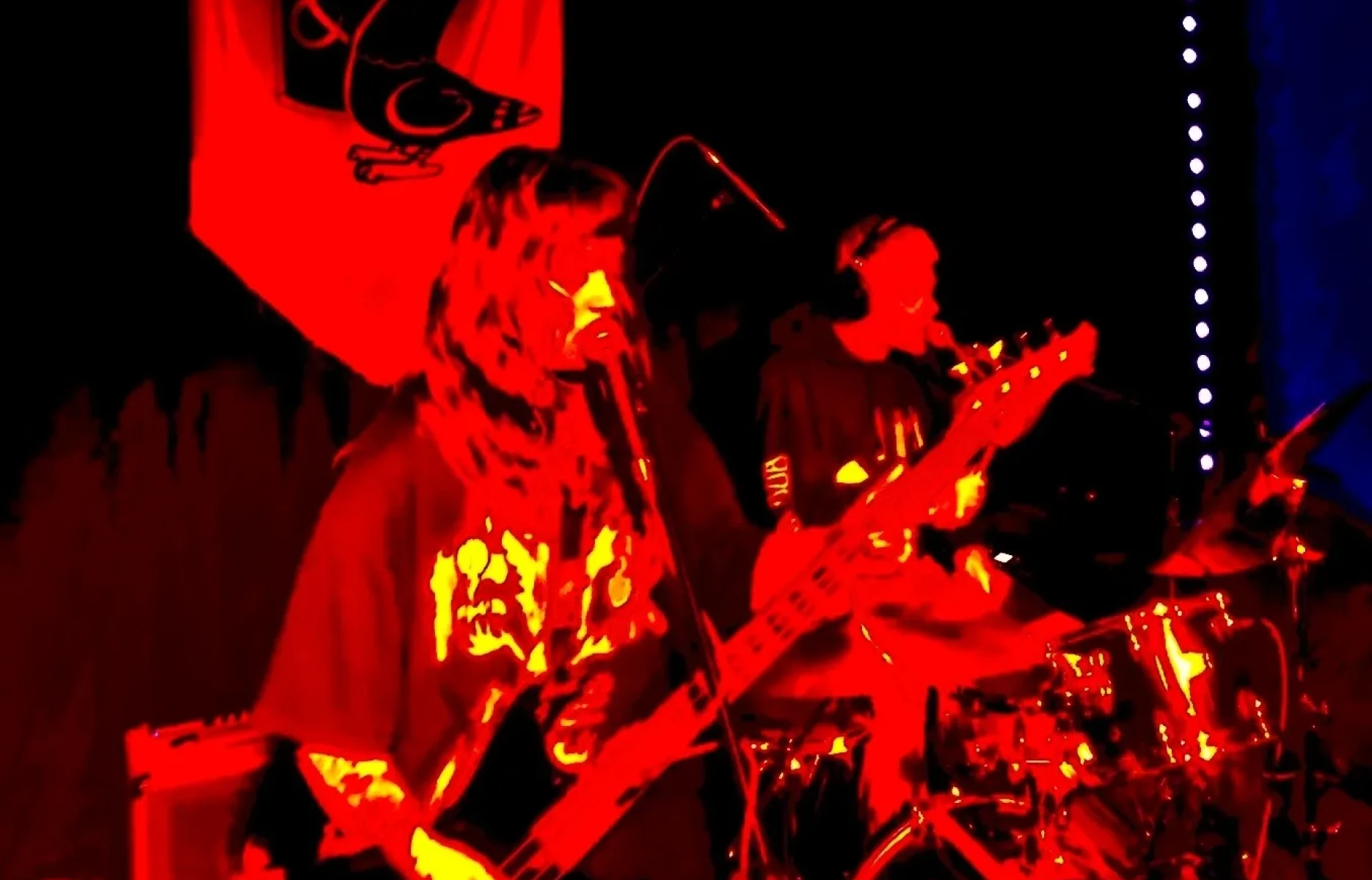 Duo performing on stage with instruments