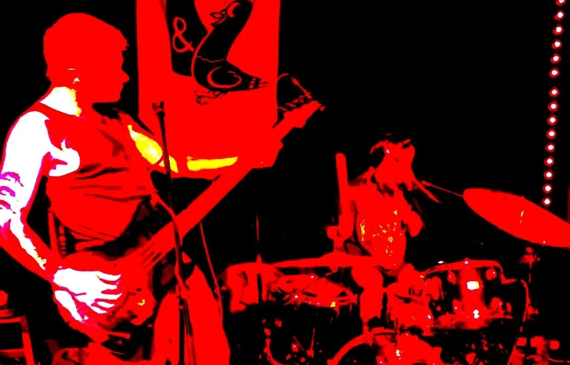 Rock band performance in silhouette